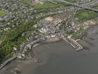 Oblique aerial view centred on the harbour with the town adjacent, taken from the NE.