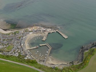 Oblique aerial view centred on the harbour with the Shorehead adjacent, taken from the SW.