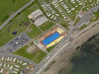 Stonehaven. Oblique aerial view centred on open air swimming pool with the Leisure Centre adjacent, taken from the S.