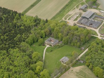 Oblique aerial view centred on the stable block, taken from the SE.