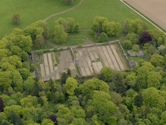 Oblique aerial view centred on the walled garden, taken from the W.