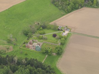 Oblique aerial view centred on the castle with the formal gardens adjacent, taken from the SE.