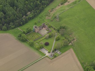 Oblique aerial view centred on the castle with the formal gardens adjacent, taken from the E.