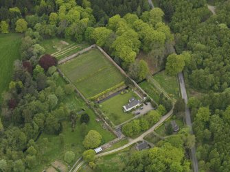 Oblique aerial view centred on the walled garden and cottage, taken from the SE.