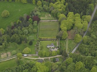 Oblique aerial view centred on the walled garden and cottage, taken from the E.