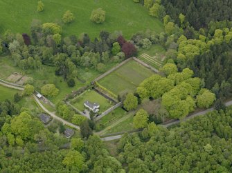 Oblique aerial view centred on the walled garden and cottage, taken from the NE.