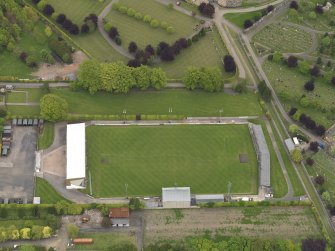 Oblique aerial view centred on the football ground, taken from the SW.