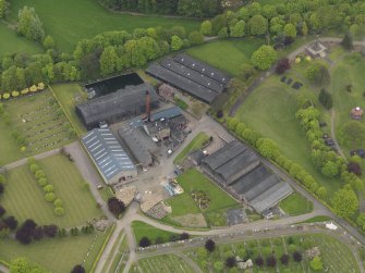 Oblique aerial view centred on the distillery, taken from the SW.