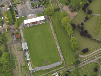 Oblique aerial view centred on the football ground, taken from the SE.