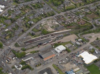 Oblique aerial view centred on the railway terminus, taken from the SW.