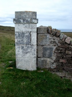 View from NW of the NW gate pier in the boundary wall of the Cape Wrath lighthouse.