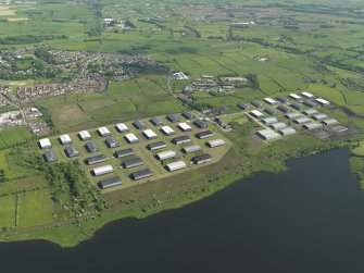 Oblique aerial view centred on the industrial estate, taken from the WNW.