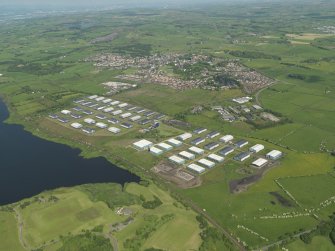 Oblique aerial view centred on the industrial estate, taken from the SW.