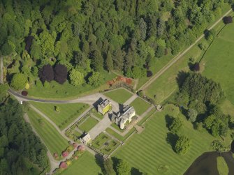 Oblique aerial view centred on the tower house/castle, taken from the W.