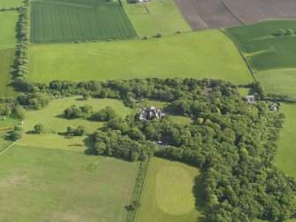 General oblique aerial view centred on the house with the policies adjacent, taken from the NNW.