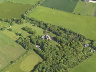 General oblique aerial view centred on the house with the policies adjacent, taken from the NW.