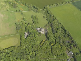 General oblique aerial view centred on the house with the policies adjacent, taken from the W.