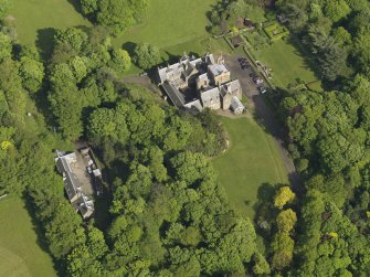 Oblique aerial view centred on the house with the terraced garden adjacent, taken from the WNW.