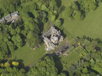 Oblique aerial view centred on the house with the terraced garden adjacent, taken from the WSW.