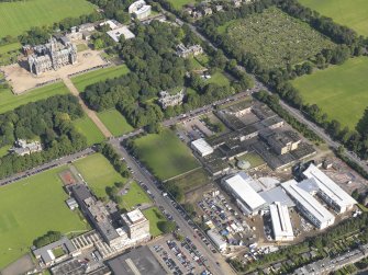 Oblique aerial view centred on Broughton High school and the construction site of the new school with the allotments of Inverleith Park and Fettes College beyond, taken from the SW.