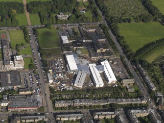 Oblique aerial view centred on Broughton High School and construction site for new school, taken from the SSW.
