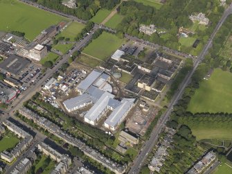 Oblique aerial view centred on Broughton High school and construction site of the new school, taken from the SE.