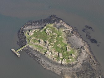 Oblique aerial view of Inchmickery centred on the 20th century military remains, taken from the S.