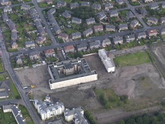 Oblique aerial view centred on Ainslie Park High School, Pilton, taken from the SSW.