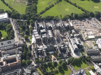 Oblique aerial view centred on the Quartermile development and the former Edinburgh Royal Infirmary, taken from the N.