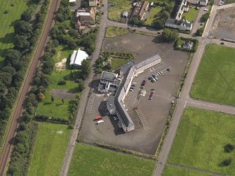 Oblique aerial view centred on Craigmillar primary school, taken from the W.