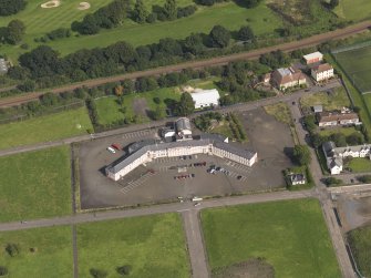 Oblique aerial view centred on Craigmillar primary school, taken from the S.