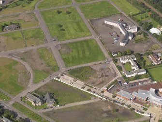 Oblique aerial view centred on site of former Niddrie Mains estate, taken from the E.