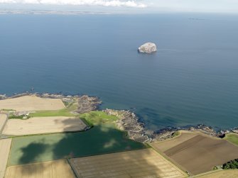 General oblique aerial view looking across Tantallon Castle towards Bass Rock, taken from the SSW.
