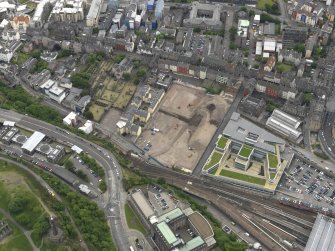 Oblique aerial view centred on the site of redevlopment with the Council Offices adjacent, taken from the NW.