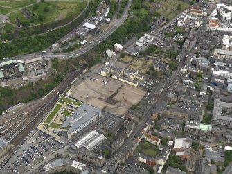 Oblique aerial view centred on the site of redevlopment with the Council Offices adjacent, taken from the WSW.