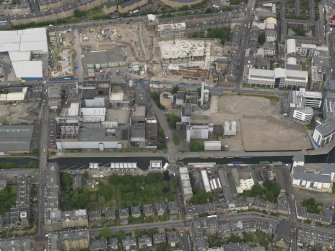 Oblique aerial view centred on the development site, taken from the  SSE.