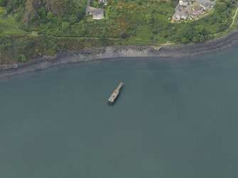 Oblique aerial view centred on the submarine mining station pier, taken from the NE.
