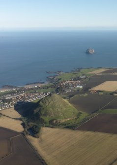 General oblique aerial view of North Berwick Law with North Berwick and the Bass Rock in the background, taken from the SW.