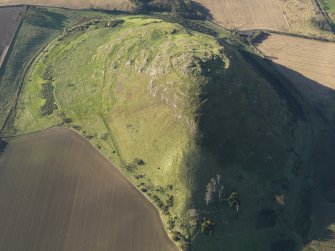 Oblique aerial view of the remains of the fort and settlement on North Berwick Law, taken from the E.