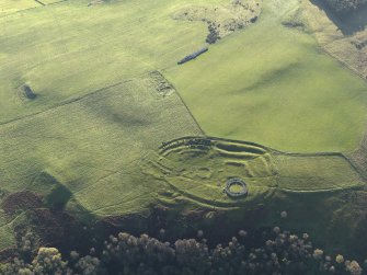 Oblique aerial view of the remains of the fort, settlement and broch at Edin's Hall and the adjacent settlement, taken from the NNE.