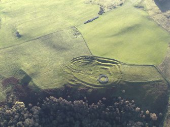Oblique aerial view of the remains of the fort, settlement and broch at Edin's Hall and the adjacent settlement, taken from the N.