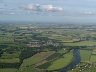 General oblique aerial view of the town in the middle distance, taken from the W.