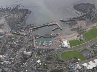 Oblique aerial view of Arbroath centred on the harbour, taken from the NNW.