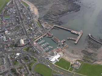 Oblique aerial view of Arbroath centred on the harbour, taken from the WNW.