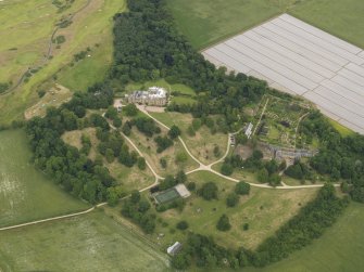 Oblique aerial view centred on Cambo House and its policies, taken from the WSW.