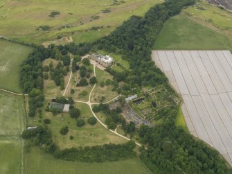 Oblique aerial view centred on Cambo House and its policies, taken from the SSW.
