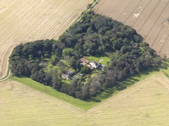 General oblique aerial view centred on the House with the gardens adjacent , taken from the NE.