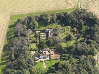Oblique aerial view centred on the House with the gardens adjacent , taken from the W.