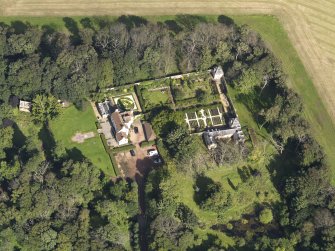 Oblique aerial view centred on the House with the gardens adjacent , taken from the S.