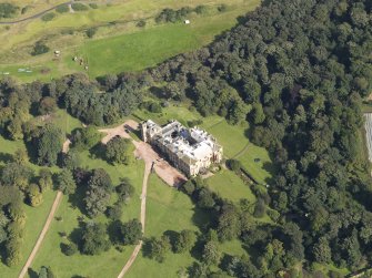 Oblique aerial view centred on the country house , taken from the SW.